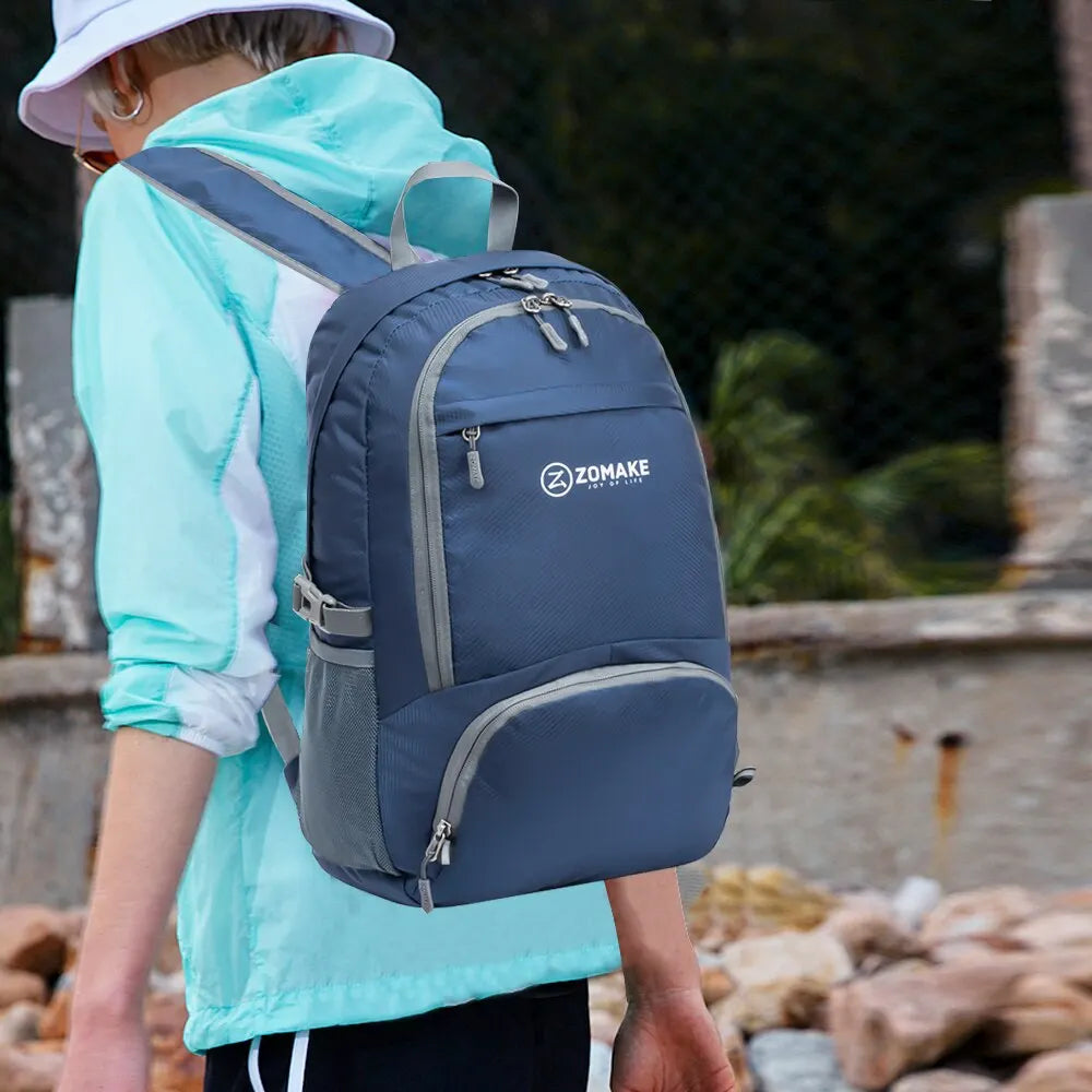 Blue high visibility backpack worn by hiker, designed for safety and comfort during outdoor trips